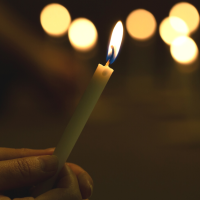 holding-burning-candle-1200.png