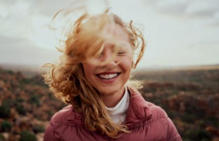 woman-smile-wind-1200.jpg