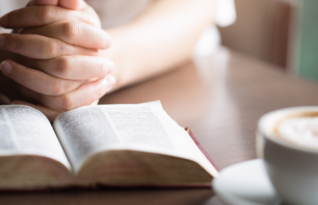 clasped-hands-open-bible-1200.png