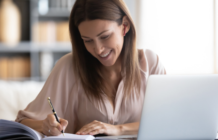smiling-woman-taking-notes-1200.png