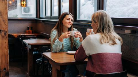Two women talking in a cafe