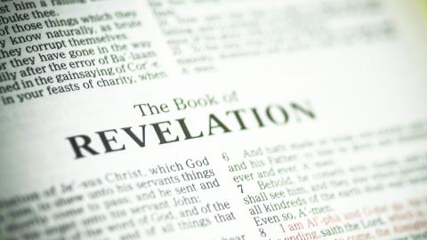 the bible opened to the book of revelations