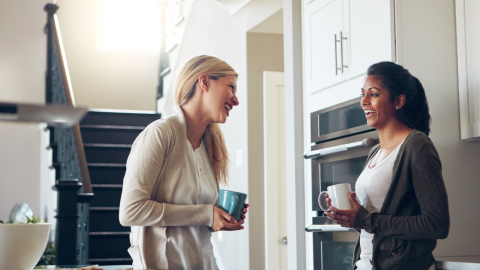 women-coffee-chat-smiling-1200.png