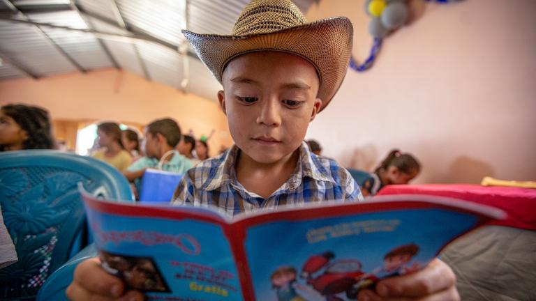 superbook-young-boy-hat-reading-superbook.jpg